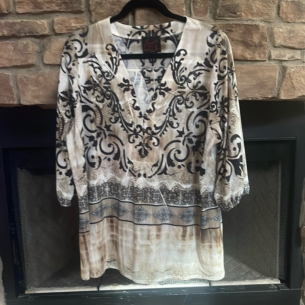 French Blue tan and black top with black and brass colored embellishments. 1X